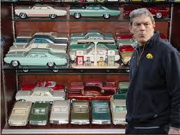 Kirk Ferentz Using Empty Trophy Case to Display Model Car Collection -  Black Heart Gold Pants