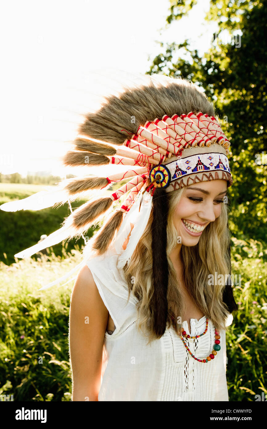 woman-wearing-native-american-headdress-CWWYFD.jpg
