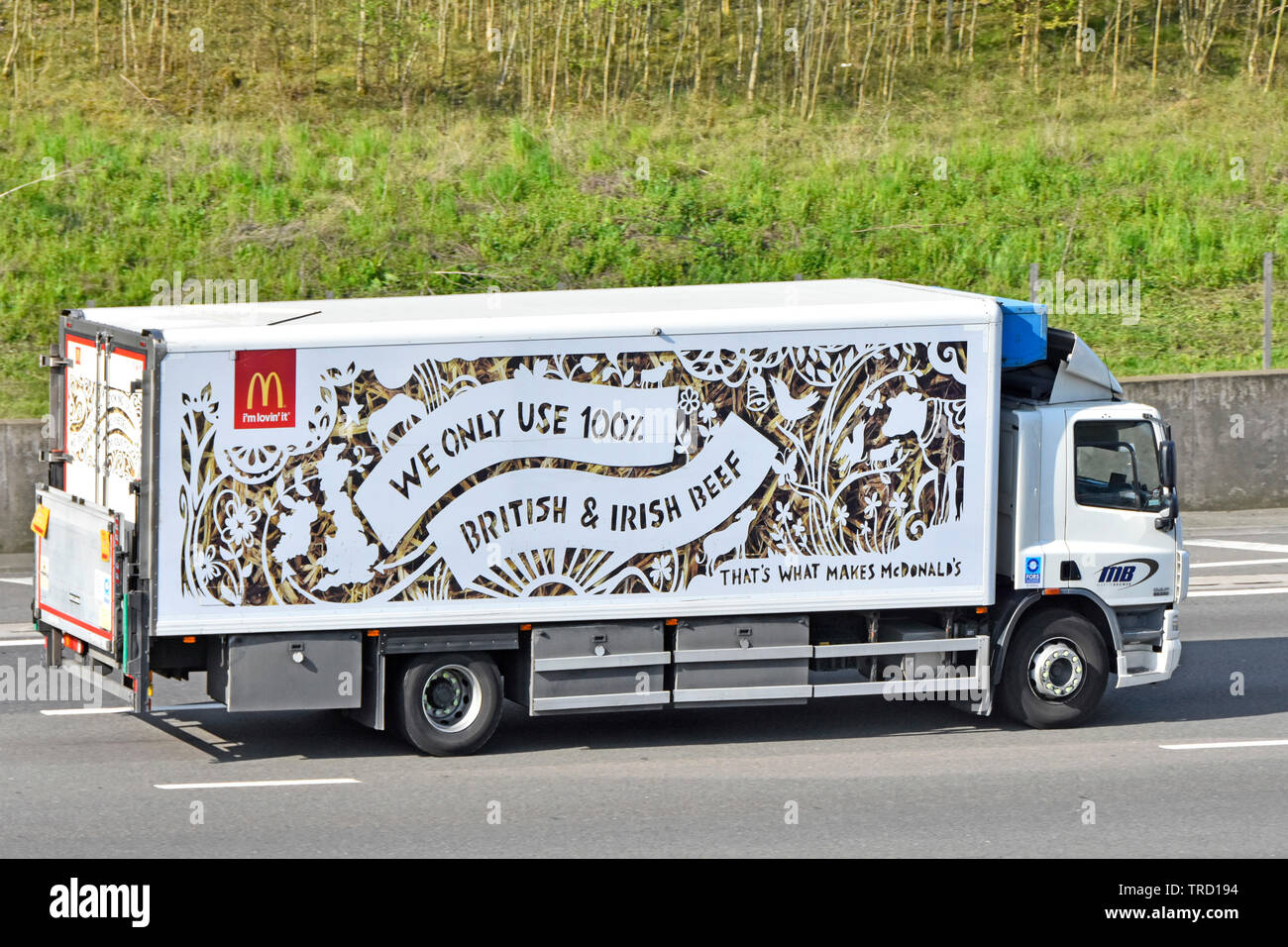 side-view-of-mcdonalds-brand-fast-food-restaurant-business-food-supply-chain-delivery-lorry-truck-advertising-use-british-irish-beef-on-uk-motorway-TRD194.jpg