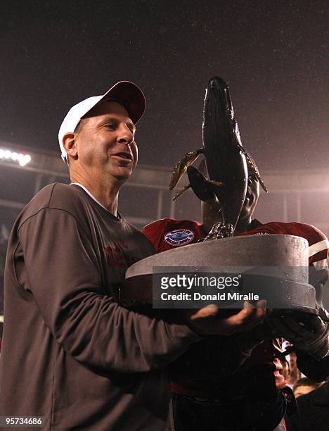 san-diego-head-coach-bo-pelini-of-the-university-of-nebraska-cornhuskers-receives-the-trophy.jpg