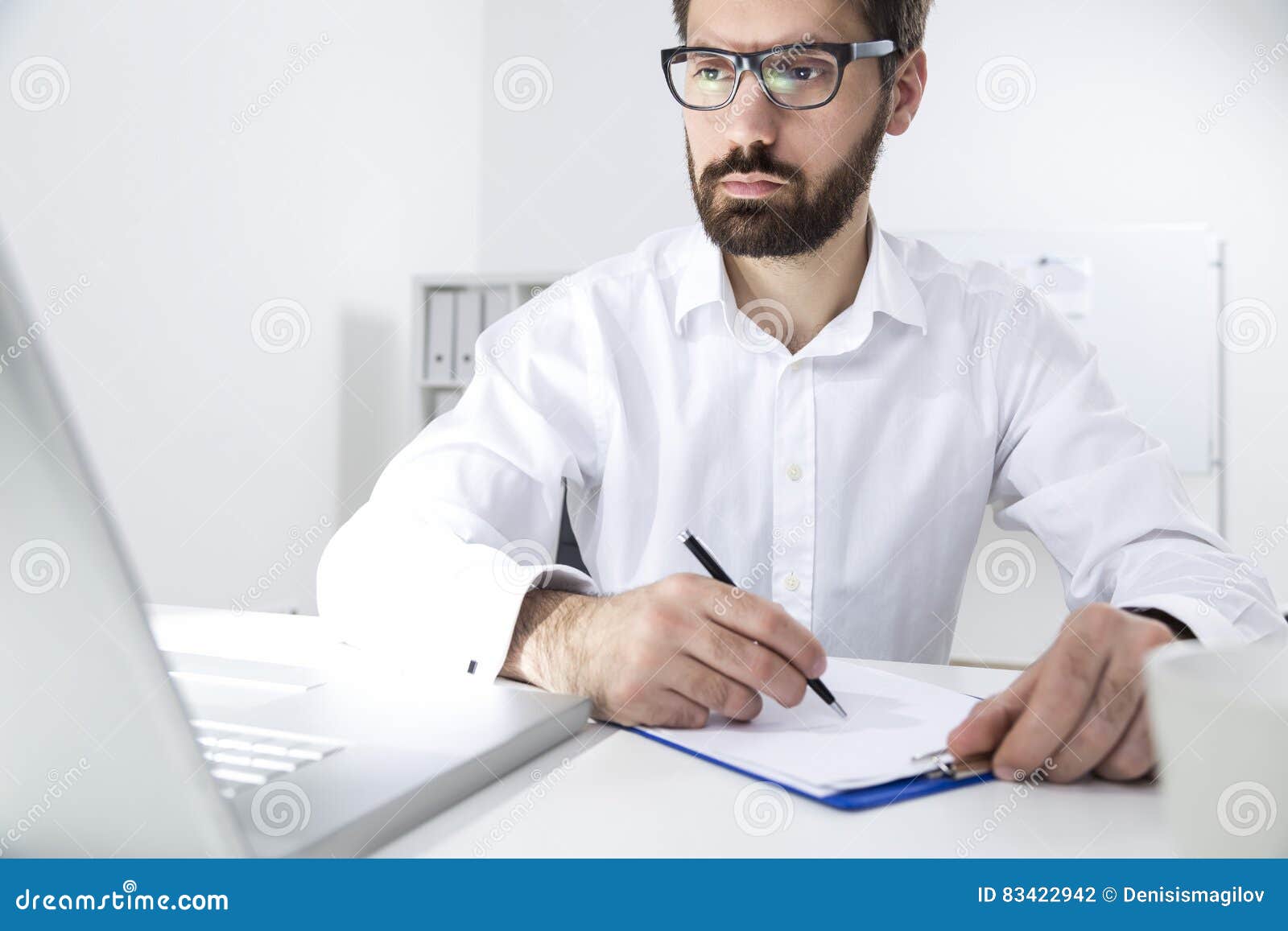 portrait-young-bearded-man-taking-notes-beard-wearing-glasses-white-shirt-sitting-his-desk-writing-83422942.jpg